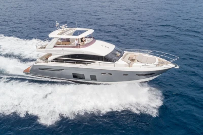 Luxury 2015 Princess 68 yacht cruising on open sea.