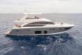 Luxury 2015 Princess 68 yacht cruising on open sea.