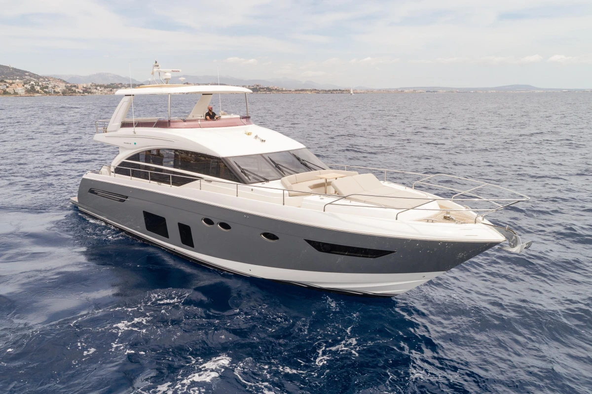 Luxurious 2015 Princess 68 yacht cruising on open sea.