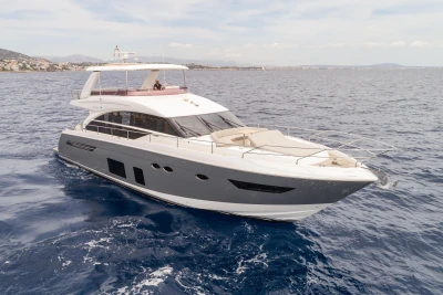 Luxurious 2015 Princess 68 yacht cruising on open sea.