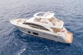Luxurious 2015 Princess 68 yacht cruising on open sea.