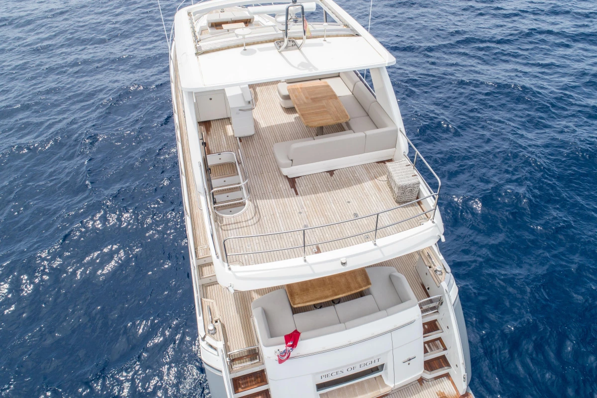 Aerial view of 2015 Princess 68 yacht on open sea, featuring spacious deck.