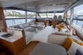 Luxurious interior of a 2015 Princess 68 yacht with elegant seating and panoramic windows.