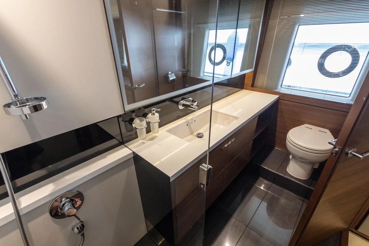 Luxurious bathroom interior of 2015 Princess 68 yacht, featuring modern fixtures and elegant design.