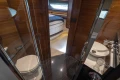 Luxurious interior of 2015 Princess 68 yacht featuring bathroom and bedroom.
