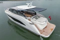2025 Princess V55 luxury yacht with sleek design and spacious deck on calm water.