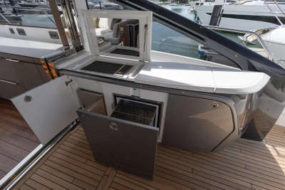 Luxury yacht Princess V55 2025 with open storage compartments and sleek design.