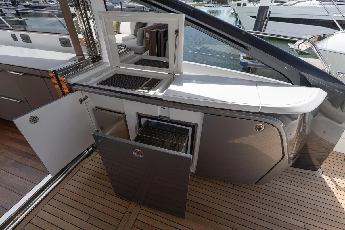 Luxury yacht Princess V55 2025 with open storage compartments and sleek design.