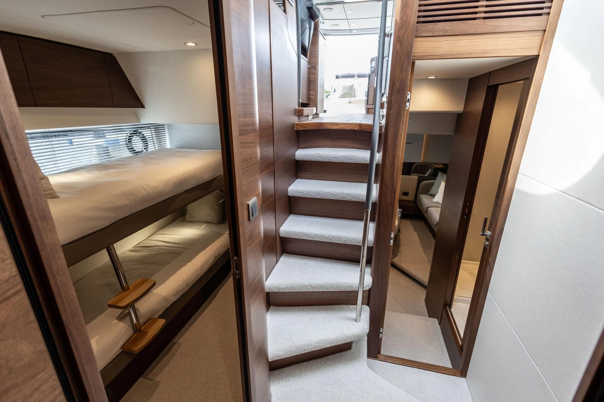 Luxurious interior of 2025 Princess V55 yacht with modern design and cozy cabins.