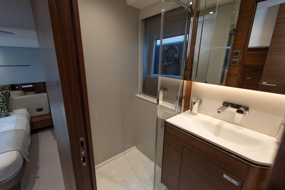 Luxurious bathroom interior of 2025 Princess V55 yacht, featuring modern sink and elegant design.