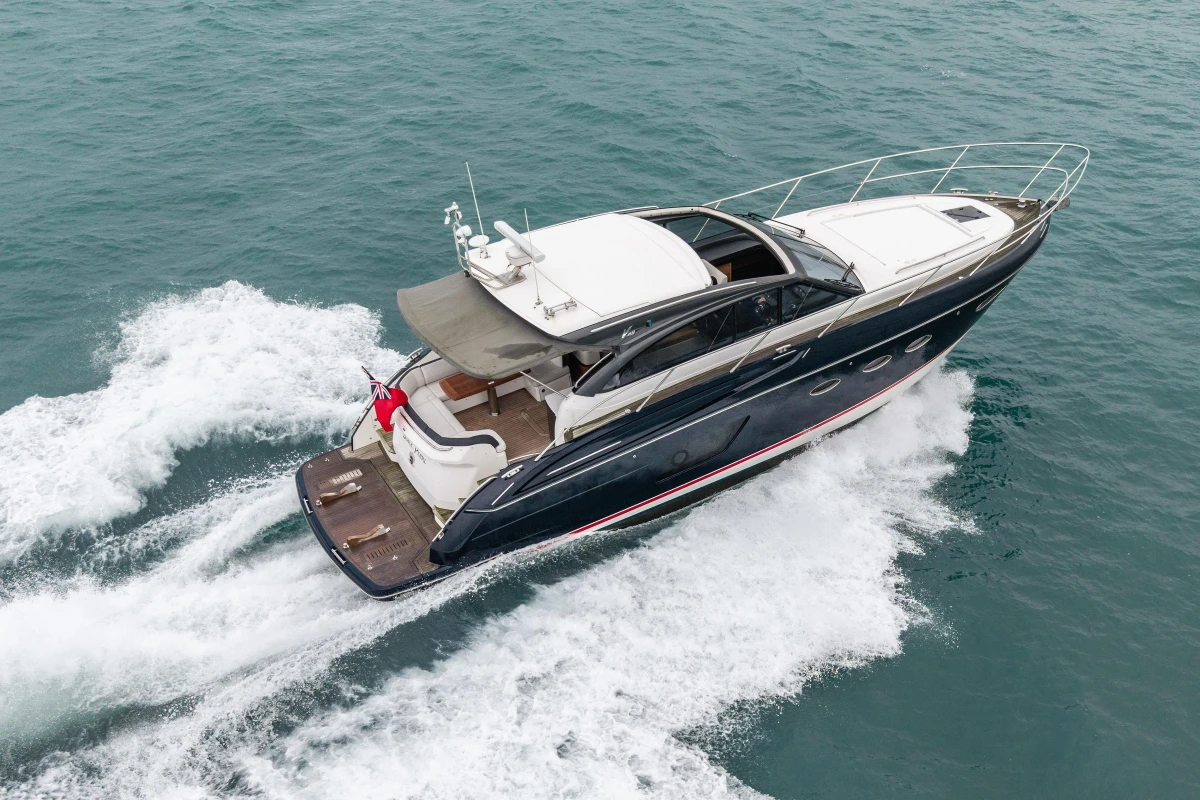 2014 Princess V48 yacht cruising on open water, aerial view.