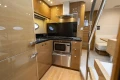 Luxurious 2014 Princess V48 yacht kitchen with modern appliances and sleek wood finishes.