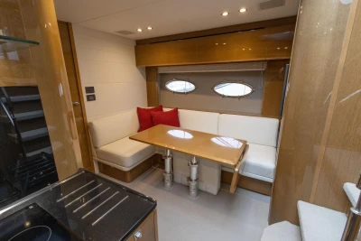 Luxurious interior of 2014 Princess V48 yacht with elegant dining area and modern design.