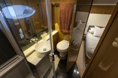 Luxurious 2014 Princess V48 yacht interior with modern bathroom and cozy bedroom.