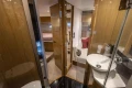 Luxurious interior of 2014 Princess V48 yacht featuring modern bathroom and cozy cabin.