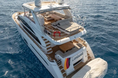 Luxurious 2017 Princess 68 yacht cruising on open sea, featuring spacious decks and elegant design.