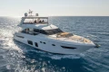 Luxurious 2017 Princess 68 yacht cruising on open sea under clear skies.