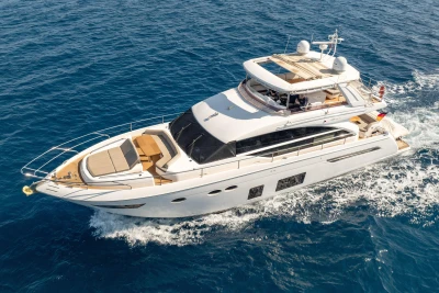 Luxurious 2017 Princess 68 yacht cruising on open blue sea.