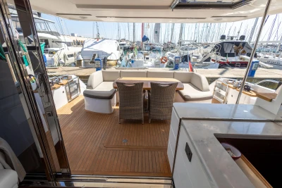 Luxurious 2017 Princess 68 yacht interior with elegant seating and marina view.