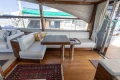 Luxurious interior of a 2017 Princess 68 yacht with elegant seating and wooden flooring.