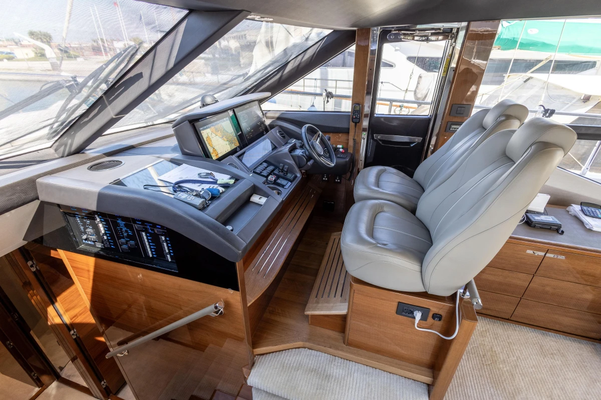 Luxurious 2017 Princess 68 yacht cockpit with modern navigation equipment and plush seating.