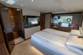Luxurious interior of 2017 Princess 68 yacht with modern bedroom design.