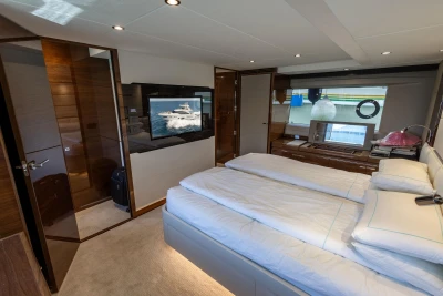 Luxurious interior of 2017 Princess 68 yacht with modern bedroom design.