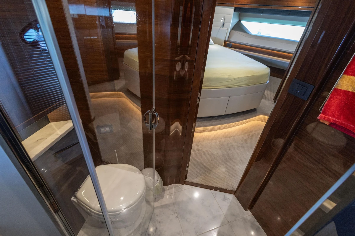 Luxurious interior of a 2017 Princess 68 yacht featuring a bedroom and bathroom.