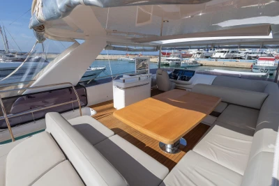 Luxurious 2017 Princess 68 yacht interior with spacious seating and wooden table.