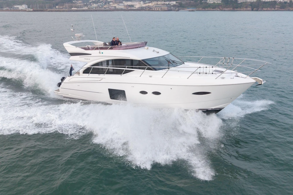 Luxurious 2017 Princess 52 yacht cruising on open water.