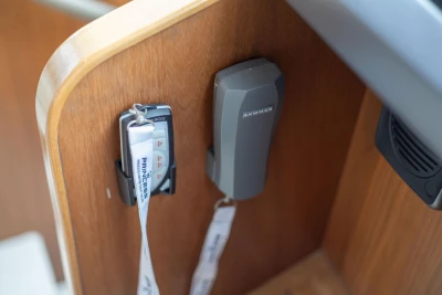 Remote controls on a 2017 Princess 52 yacht, mounted on a wooden panel.