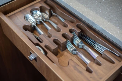 Wooden cutlery drawer with organized silverware in a Princess 52 yacht, 2017 model.