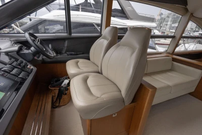 Interior of 2017 Princess 52 yacht with leather seats and control panel.