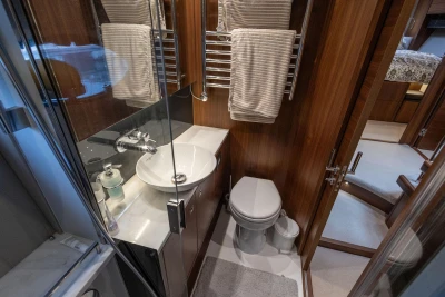 Luxurious bathroom in 2017 Princess 52 yacht with modern fixtures and wooden accents.