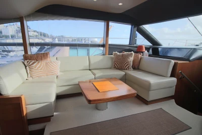 Luxurious interior of 2017 Princess 52 yacht with elegant seating and decor.