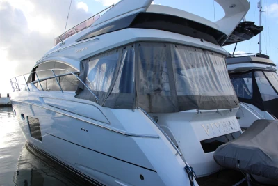 Luxurious 2017 Princess 52 yacht docked, showcasing sleek design and modern features.