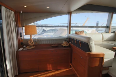 Luxurious interior of 2017 Princess 52 yacht with elegant wood and leather furnishings.