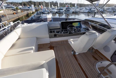 Luxurious cockpit of Princess F50 yacht, 2025 model, docked at marina.
