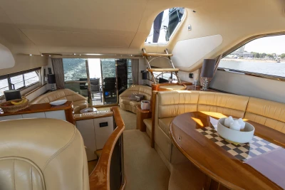Luxurious interior of a 1995 Princess 60 yacht with elegant seating and dining area.