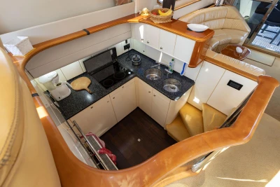 Luxurious kitchen interior of a 1995 Princess 60 yacht with modern amenities.