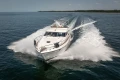 Luxury Princess 60 yacht cruising on open water, 1995 model.