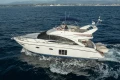 Luxury 2012 Princess 50 yacht cruising on open sea.