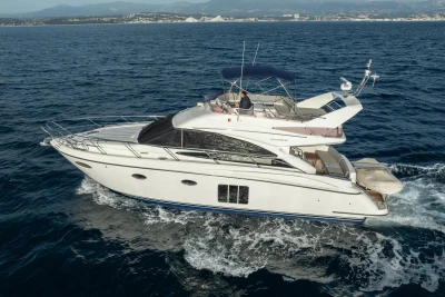 Luxury 2012 Princess 50 yacht cruising on open sea.