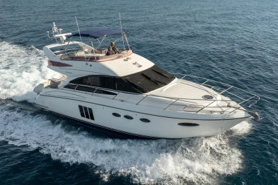 Luxury 2012 Princess 50 yacht cruising on open water.