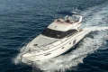 Luxury 2012 Princess 50 yacht cruising on open water.
