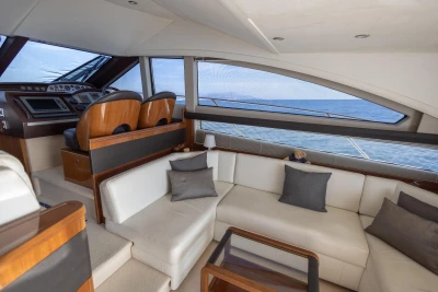 Luxurious interior of 2012 Princess 50 yacht with modern seating and ocean view.