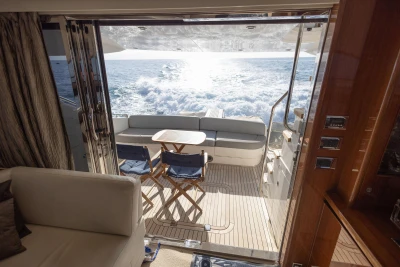 Luxurious 2012 Princess 50 yacht interior with ocean view and elegant seating area.