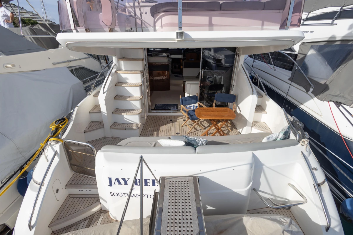 Luxury Princess 50 yacht, 2012 model, featuring spacious deck and elegant seating area.