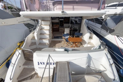 Luxury Princess 50 yacht, 2012 model, featuring spacious deck and elegant seating area.