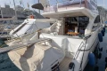 Luxury Princess 50 yacht, 2012 model, docked at marina with visible deck and seating area.